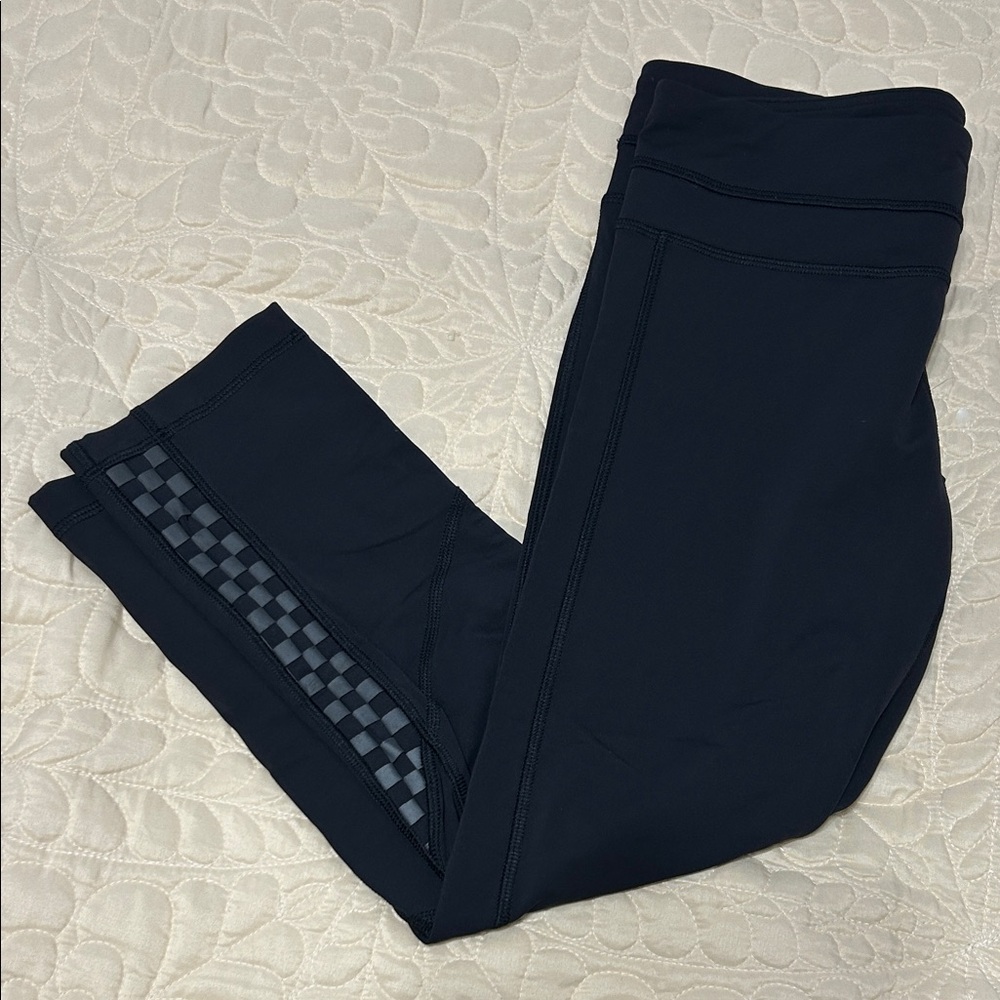 Lululemon Women’s Black Capri Leggings with reflective detail.  Like new.